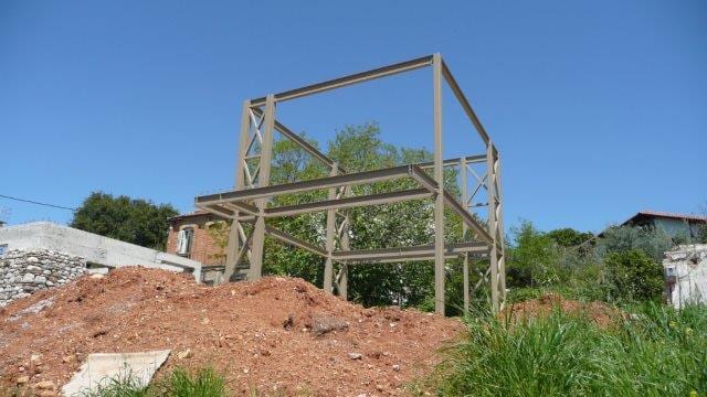 Steel frame of the two-story house in Patras, side view