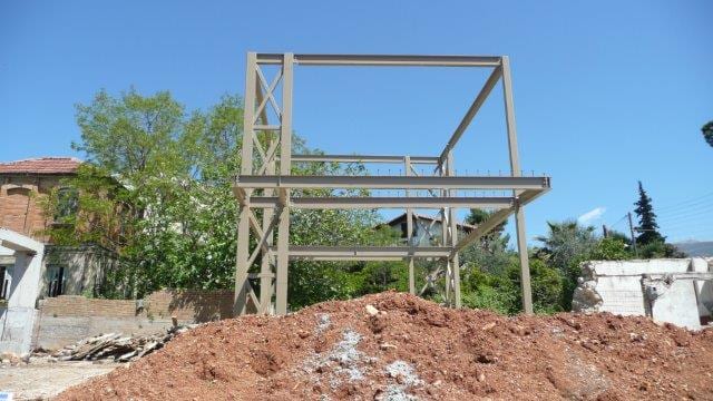Completed steel frame of the two-story house in Patras, front view
