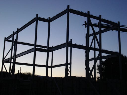 Steel frame of the two-story house in Episkopiko, Ioannina, against the dusk sky