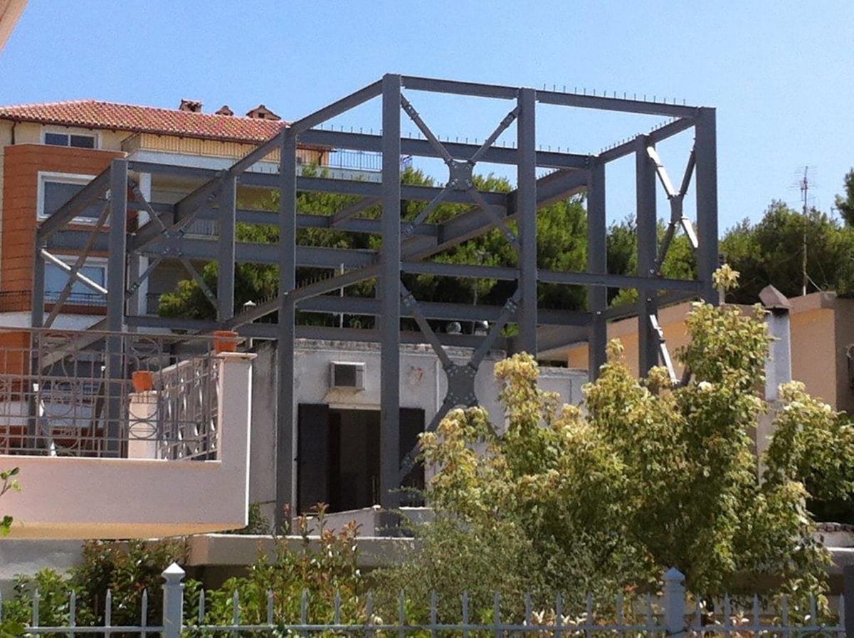 Steel frame of a house extension with cross bracing in Melissia