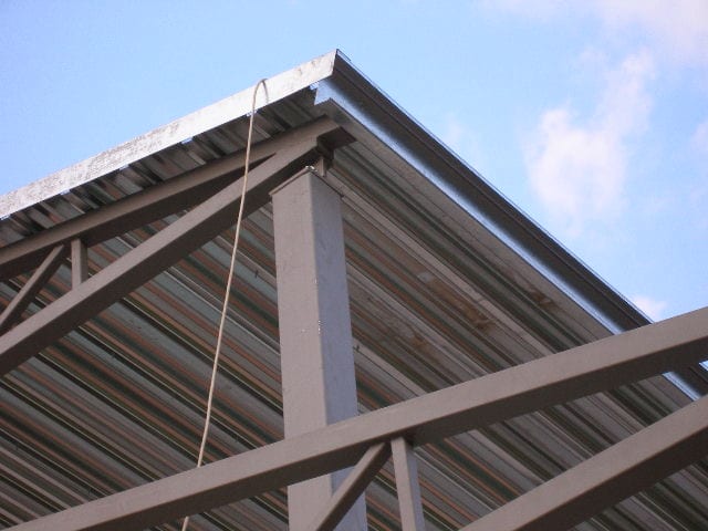 Detail of a roof corner with metal sheet on a steel truss in Filippiada