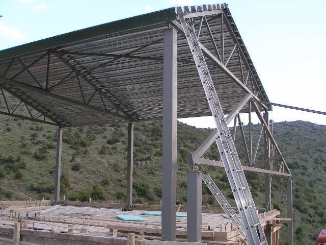 Steel frame with trusses and roof sheet of a house in Agios Georgios, Filippiada