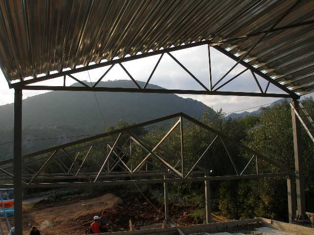 Lattice trusses with the metal sheet for the roof covering of a house in Agios Georgios, Filippiada