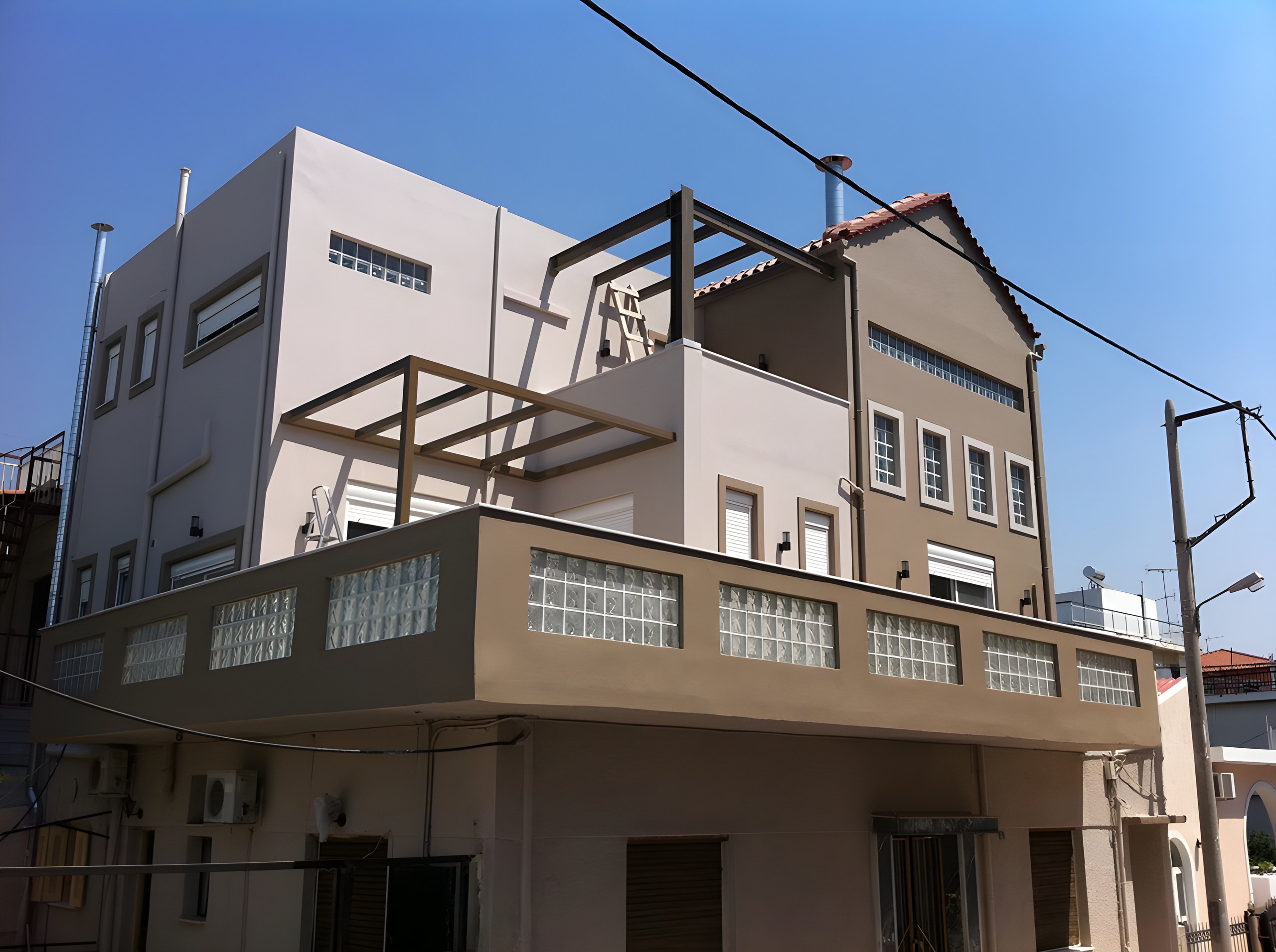 Two-story vertical addition to a home in Chaidari