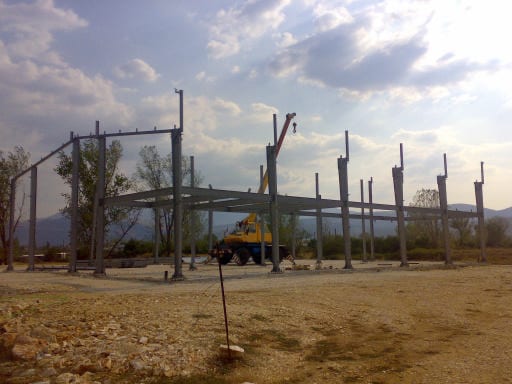 Early stage of column erection with a crane at the workshop in Bafra, Ioannina
