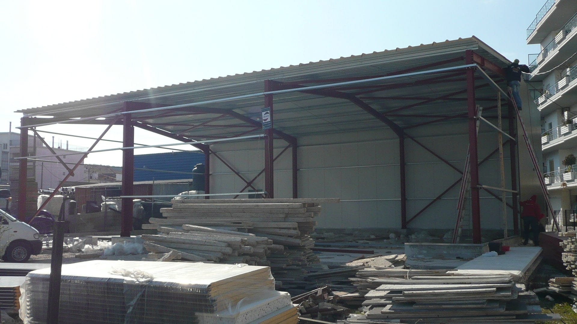 Installing roof and wall cladding panels on the olive oil warehouse in Ioannina