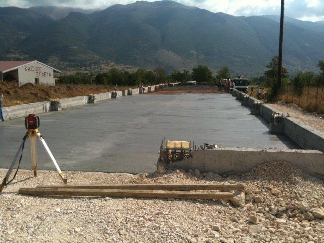 Pouring the concrete slab on grade at the workshop building on the Eleousa plain