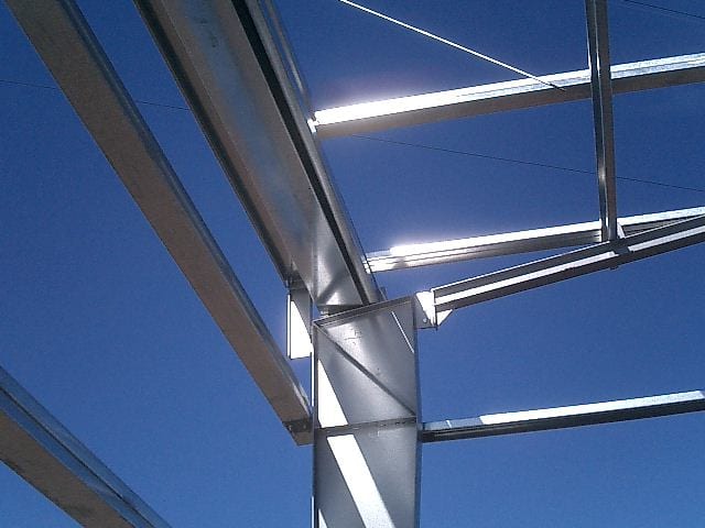 Detail of a variable-section column and beams in the frame of the Modeco showroom
