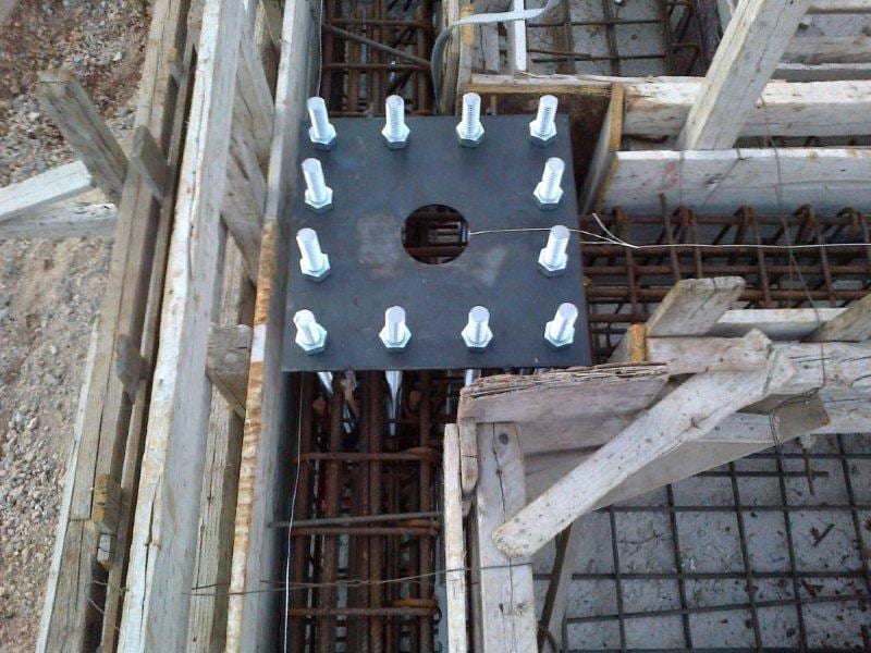 Base plate with anchor bolts set in the foundation rebar in Razata, Kefalonia