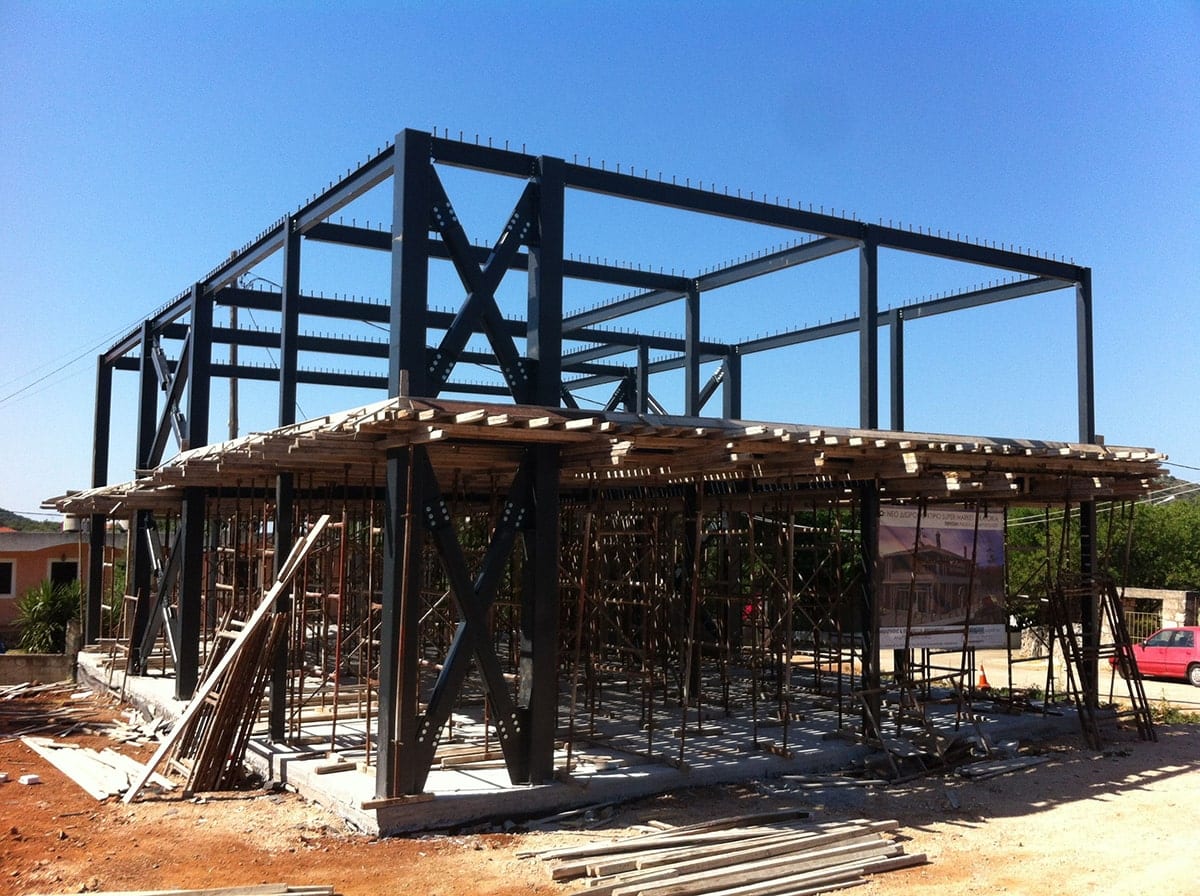 Steel and concrete structure during the slab pour at the store and house in Razata, Kefalonia
