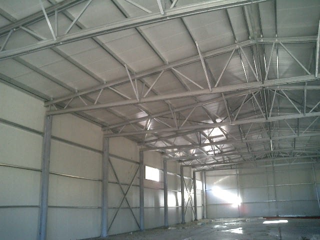 Interior of the SMS building with galvanized lattice trusses in Tzavros, Corfu