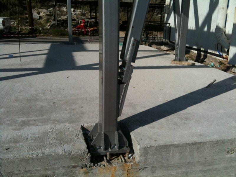 Steel column base with recessed anchor bolts at the bakery workshop in Vlychos, Lefkada
