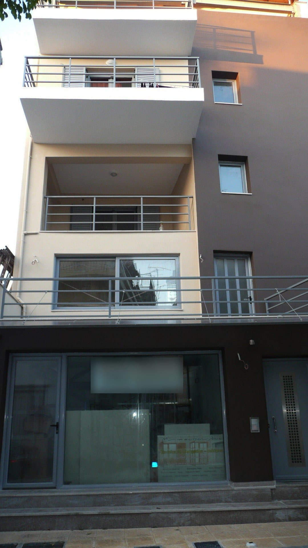 Completed front of the apartment building with a shop, offices and apartments in Missolonghi