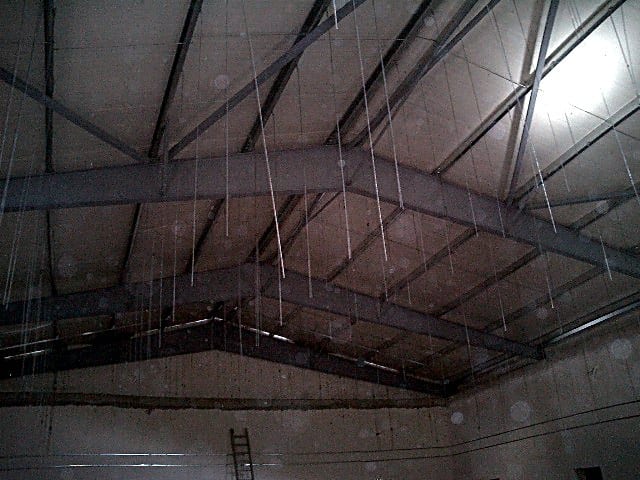 Interior with steel roof rafters and purlins at the venue in Plataria, Thesprotia