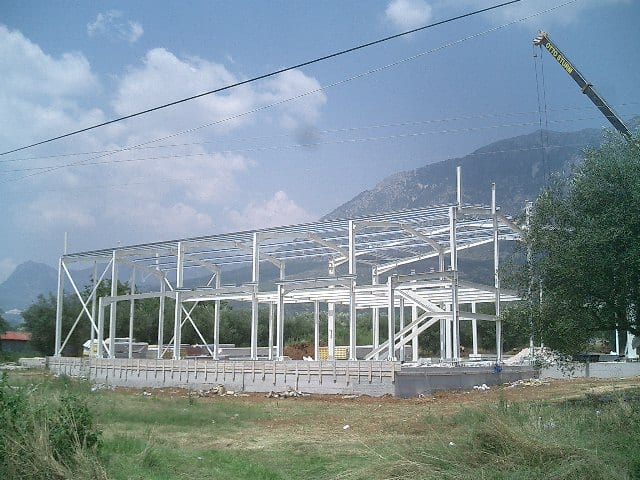 Erection of the steel frame of the distillery in Paramythia, Thesprotia, with a crane