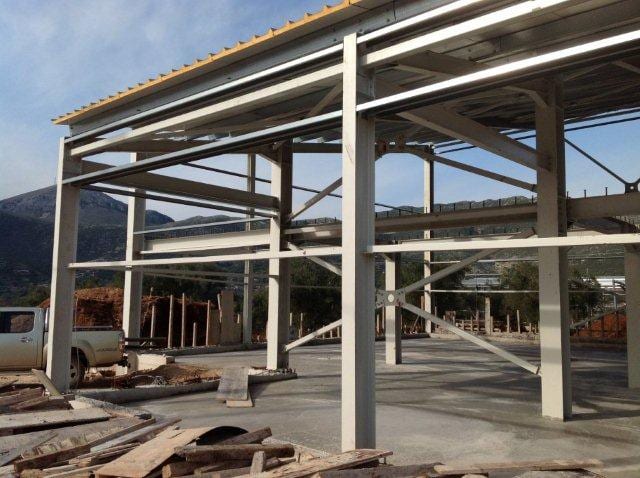 Steel frame with mezzanine and cross bracing at the workshop in the industrial park of Paramythia
