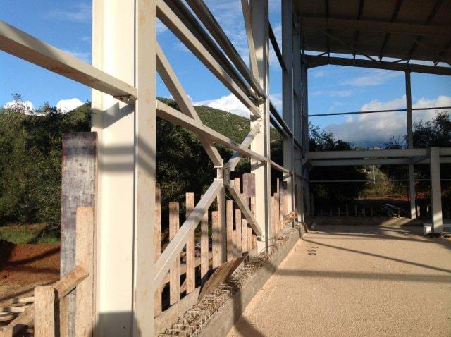 Steel columns and cross bracing around the perimeter of the workshop in the industrial park of Paramythia