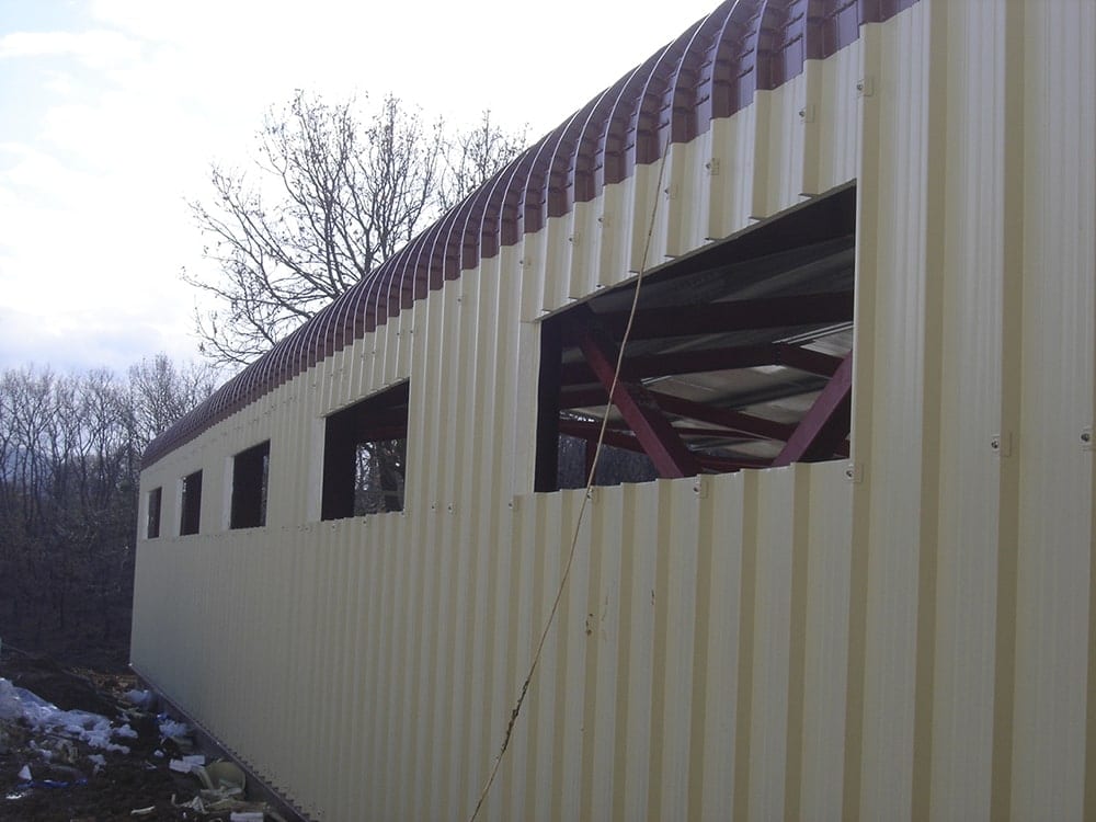 Curved trim piece joining the roof and wall cladding at the cattle barn in Selefkeia, Thesprotia