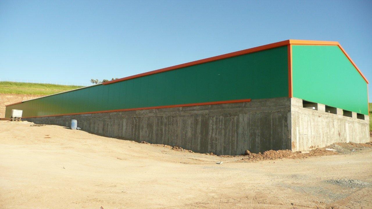 Exterior view of the completed rabbit farm in Thiva with cleaning openings at the base