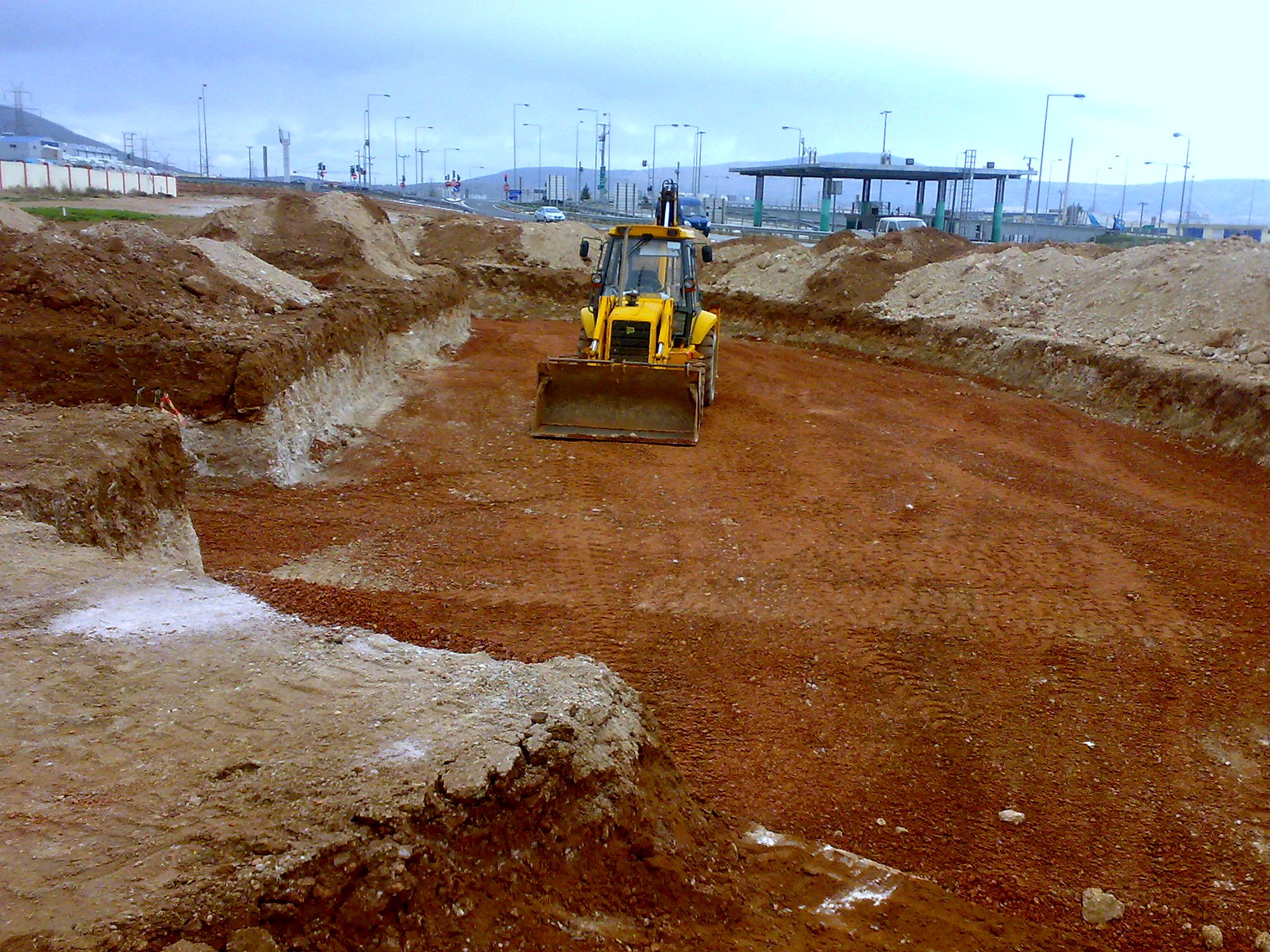 Excavation of the plot for the foundation of a steel vehicle inspection center building in Aspropyrgos, Attica
