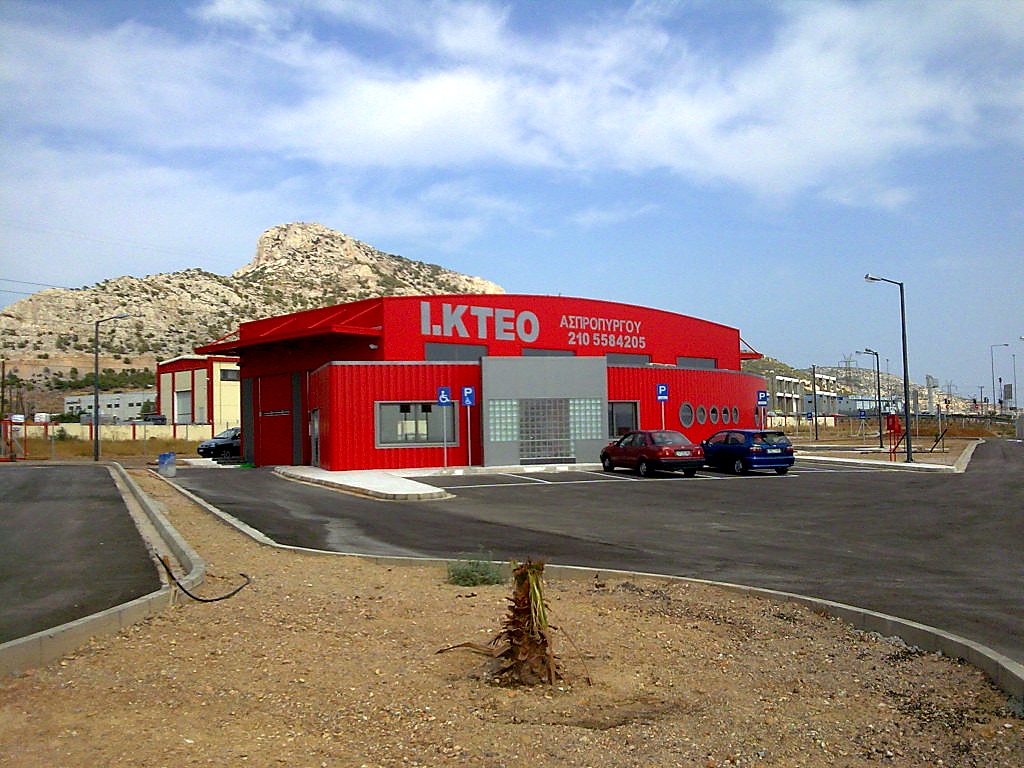 General view of the completed steel vehicle inspection center building with parking area in Aspropyrgos, Attica