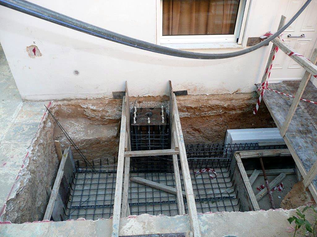 Strip footing reinforcement next to an existing house for a steel frame extension in Melissia, Attica