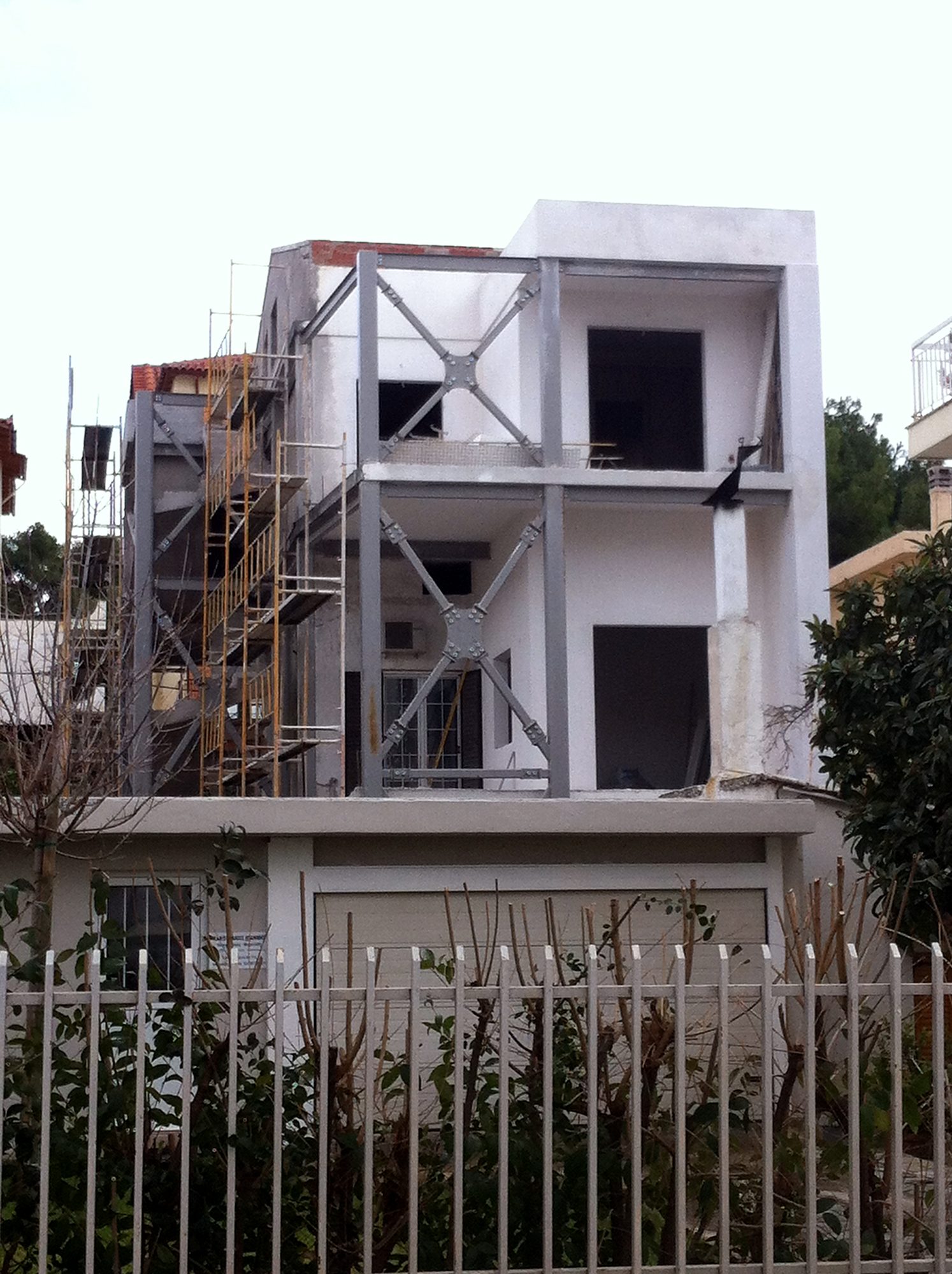 View of a house extension with exposed steel frames and bracing, Melissia, Attica