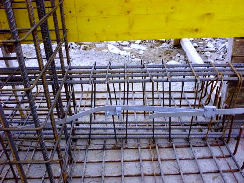 Strip footing rebar next to steel formwork, workshop building in Karystos, Evia