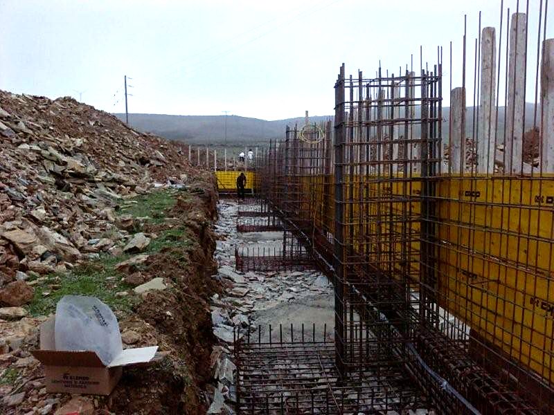 Rebar for the walls and strip footings with forms, foundation of a steel building in Karystos, Evia