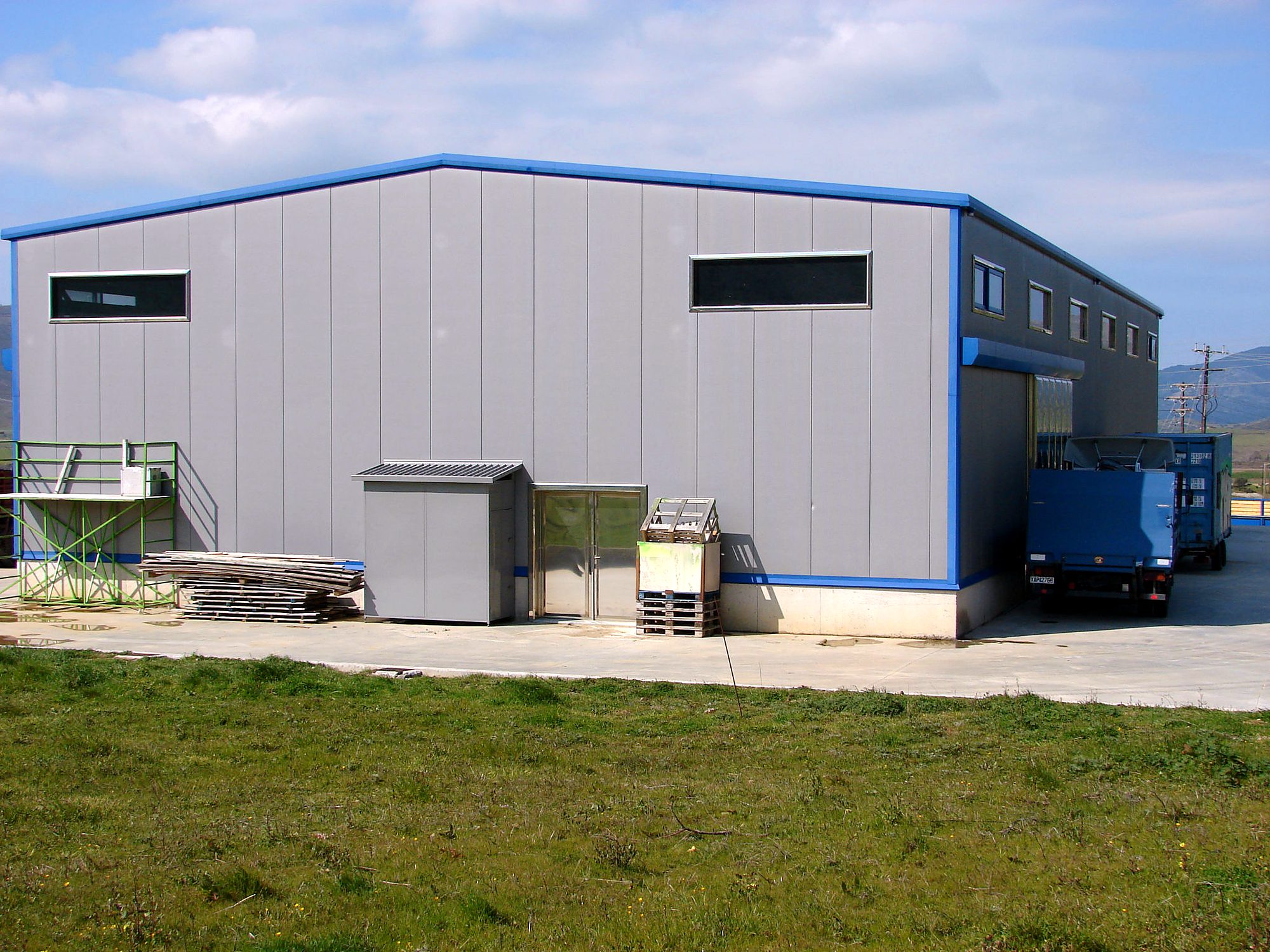 Gable of the completed steel building with panel wall cladding, workshop in Karystos, Evia
