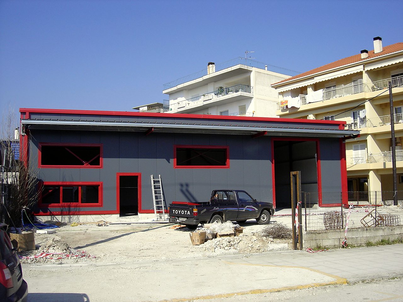 Main elevation of the completed steel olive oil trading warehouse with wall cladding panels, Ioannina