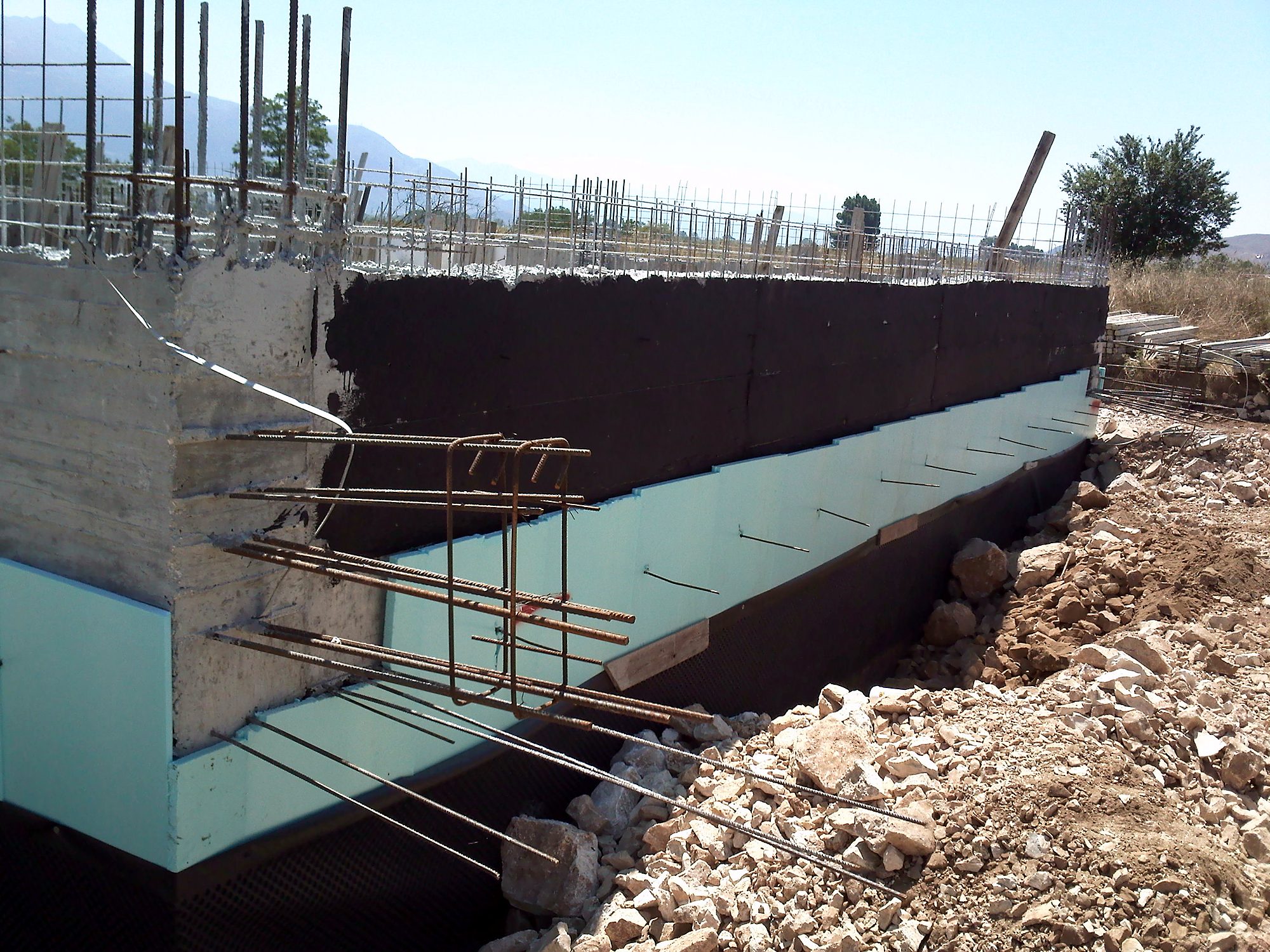 Waterproofing and thermal insulation of an exterior basement wall at a workshop building in Eleousa, Ioannina