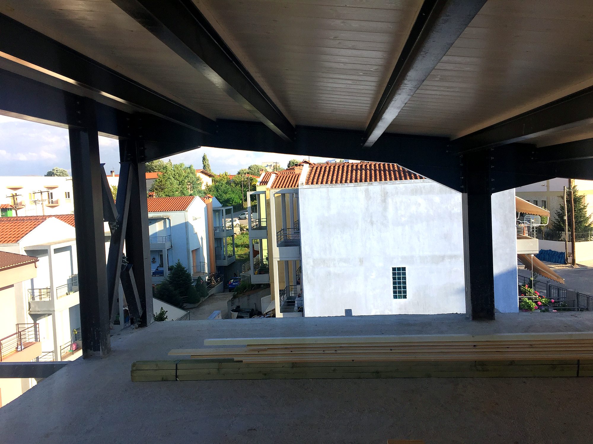 Underside of a composite slab with steel beams at the pilotis of a house in Neochoropoulo, Ioannina