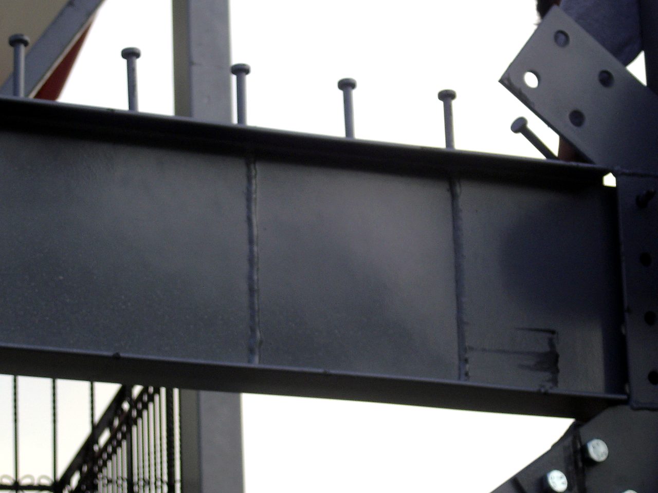 Steel beam with shear studs for a composite slab and a bolted gusset plate, guesthouse in Ioannina
