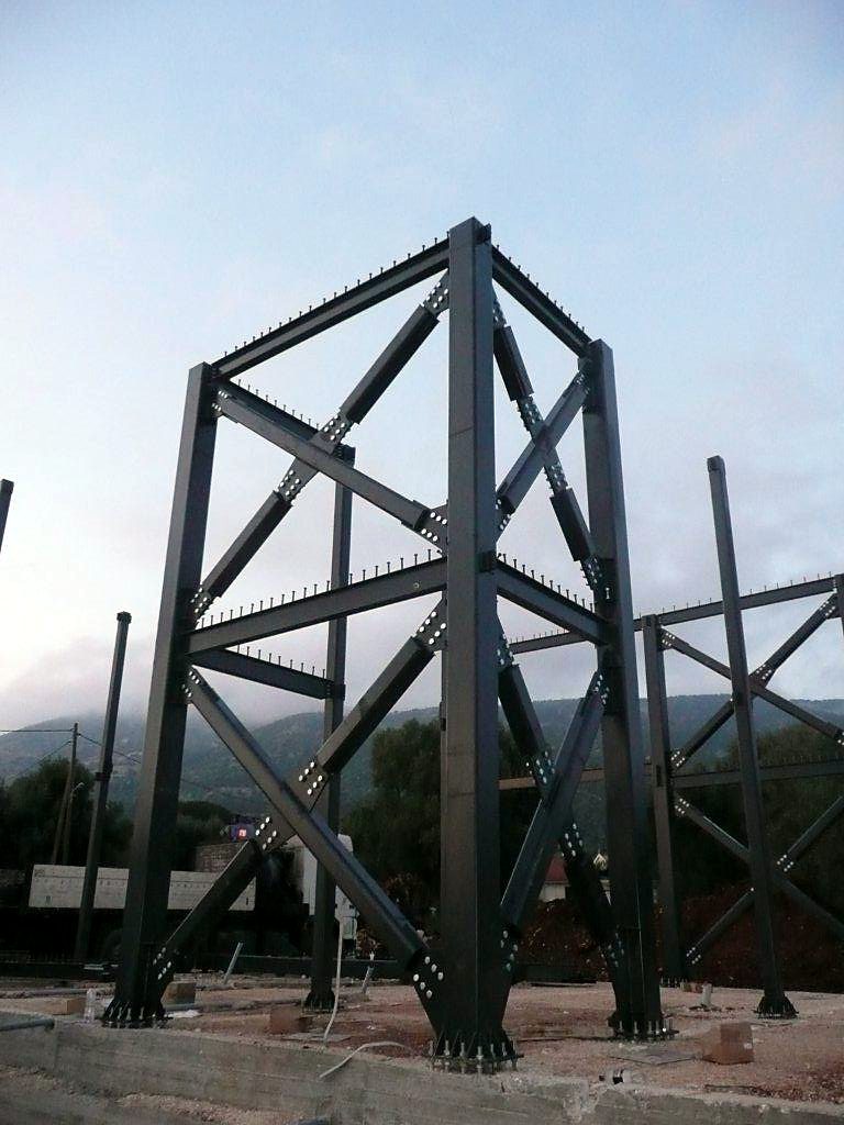Steel braced core with bolted cross bracing in the store and house building in Razata, Kefalonia