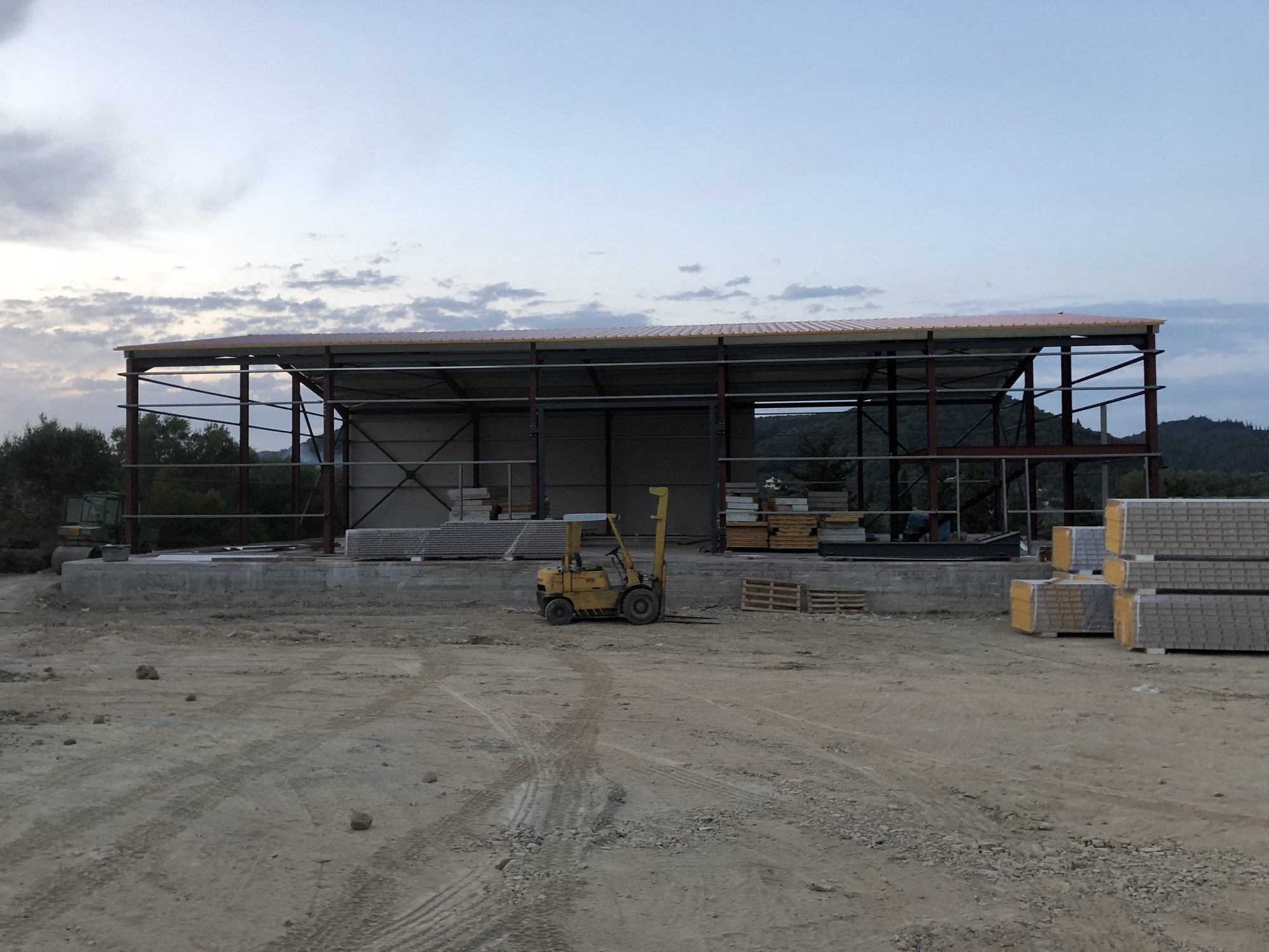 Wall and roof cladding in progress, Warehouse buildings of the food distribution company A. Kaloudis & SIA EE in Arillas, Corfu