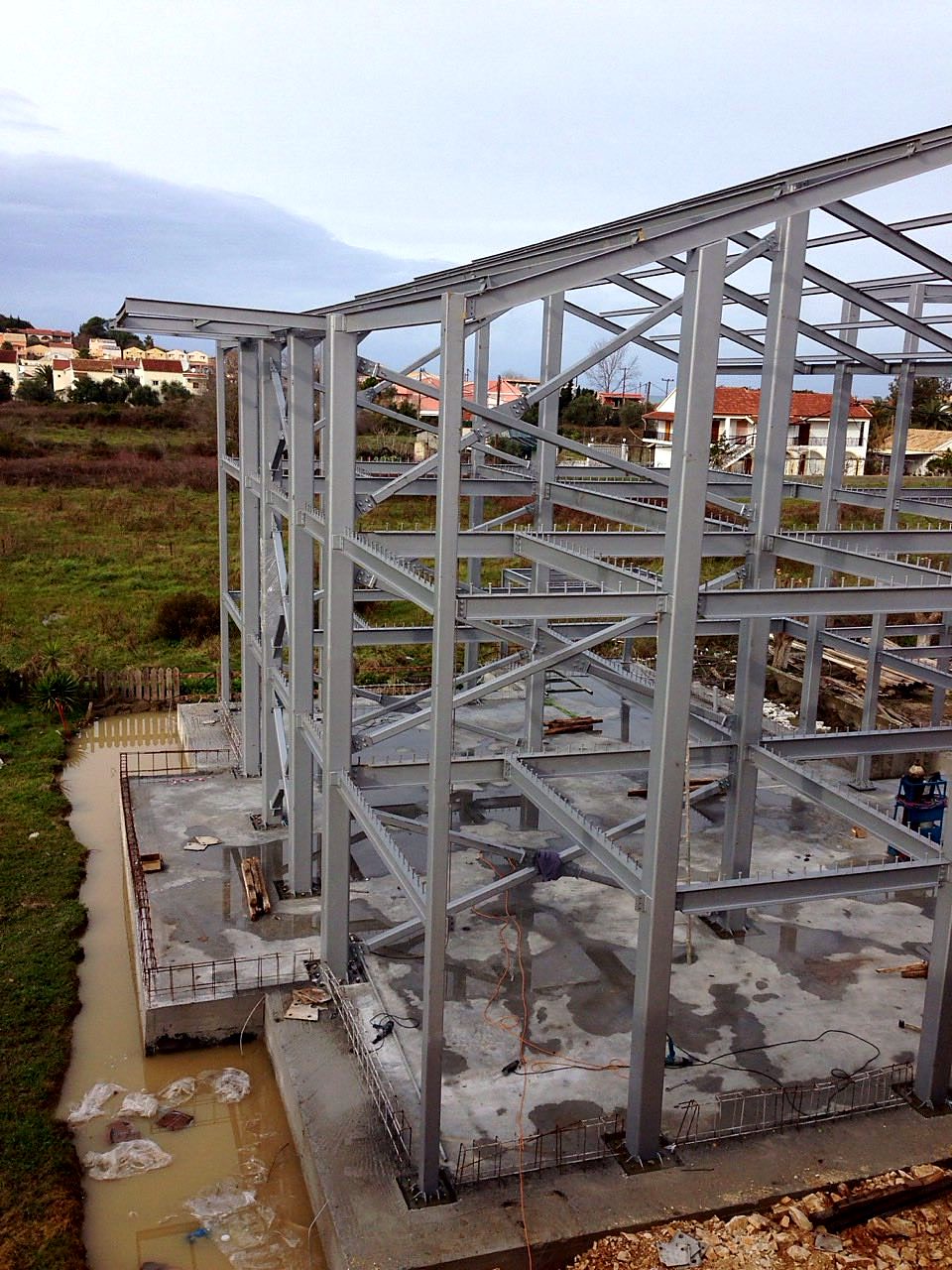 Three-story steel frame of a hotel building with bracing in Sidari, Corfu