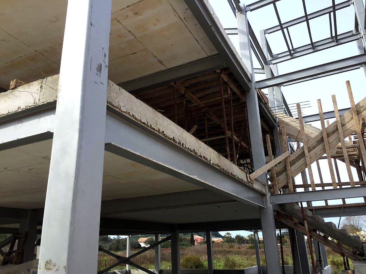 Steel column and floor beams with slab formwork at a hotel in Sidari, Corfu