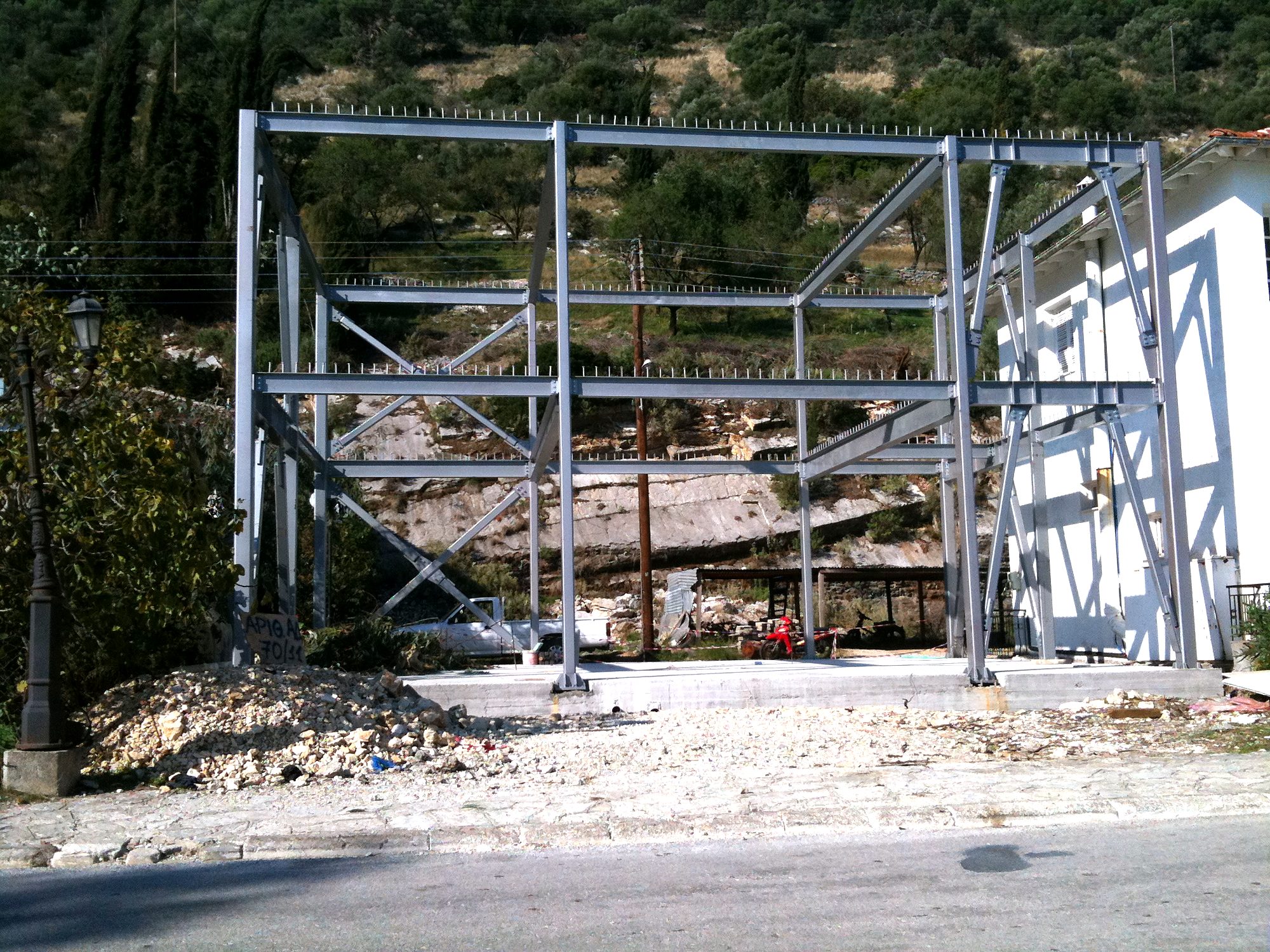 Two-story steel frame with diagonal bracing for a bakery workshop in Vlychos, Lefkada