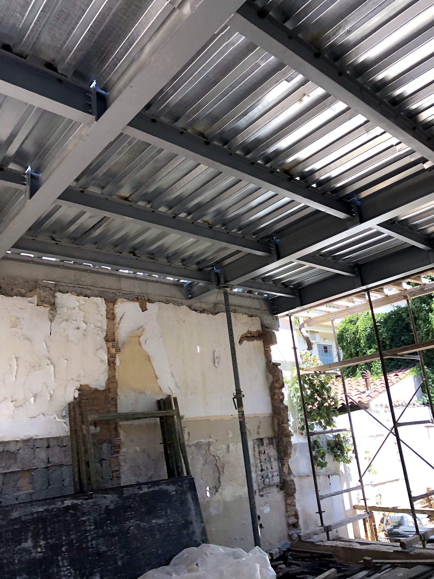 Composite slab steel deck on steel beams, seen from below, building in Petralona, Athens
