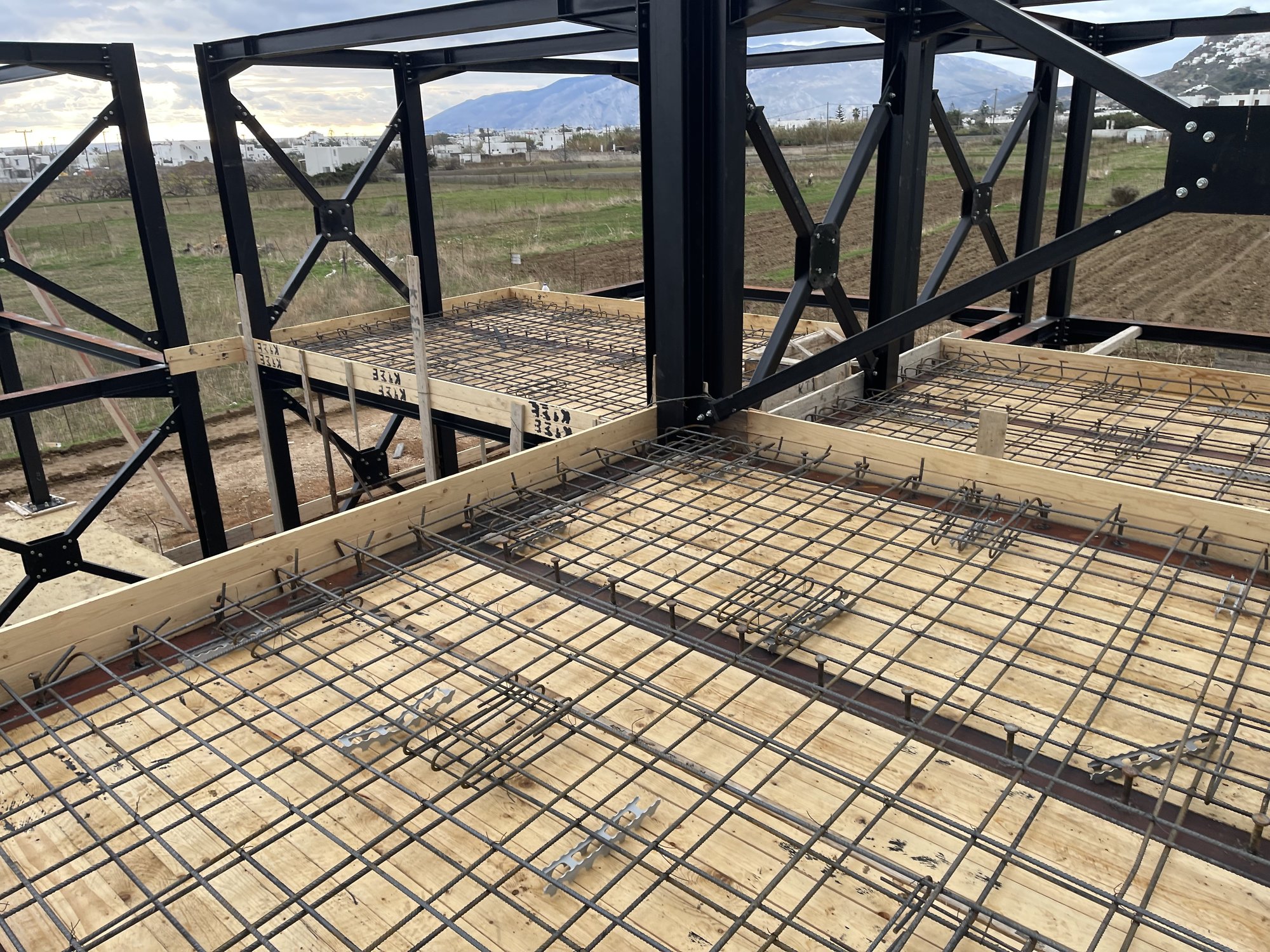 Rebar of the composite floor slab and cross bracing, Rental rooms on Skyros |